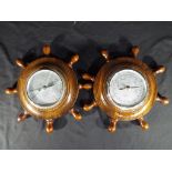 Two barometers in the form of ship's wheels, approximately 26 cm (d) (2).