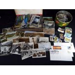 A lot to include a quantity of postcards, tea cards and small quantity of first day covers.