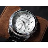 Michael Kors - a Michael Kors wristwatch with multiple dials, stone set,