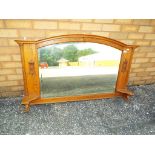 A good quality wood framed bevel edged oval mantel mirror with carved detailing,