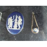 Two Wedgwood items including a Jasperware oval plaque and a tri-colour pendant.