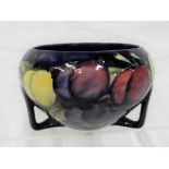 Moorcroft - A Moorcroft Pottery bowl raised on three supports (restoration to one support),