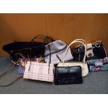 A collection of eight lady's handbags