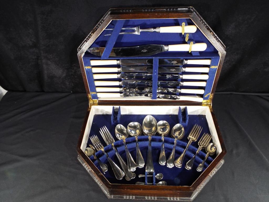 A large good quality wooden canteen of cutlery with blue interior circa 1960s comprising six dinner
