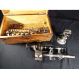 A watchmaker's 6 mm lathe with associated accessories, contained in wooden case, Est £80 - £120.