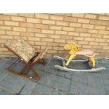 A child's vintage rocking horse and a child's folding rocking chair with upholstered seat and back.