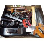 A quantity of hand tools include planes, saws and similar.
