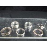 Six silver rings, various sizes.