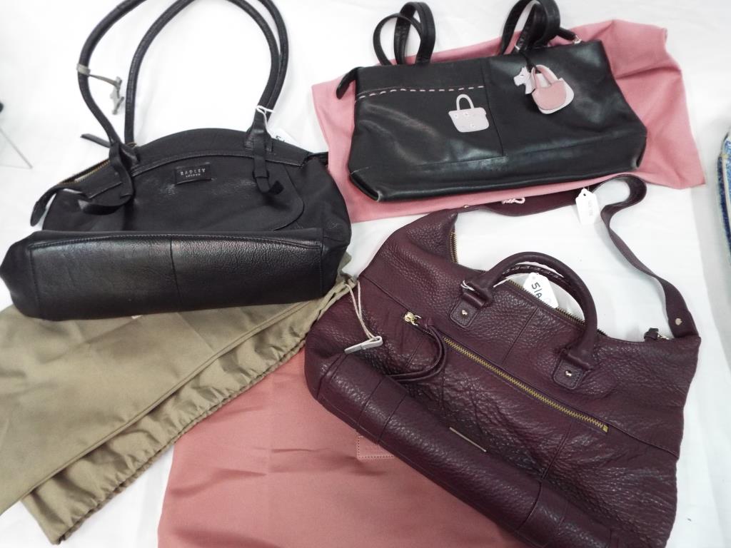 Radley Handbags - three good quality fashion Radley handbags in original dust covers comprising a