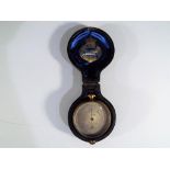 A Callaghan and Co brass pocket barometer, dial marked 23A New Bond Street London,