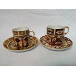 Royal Crown Derby - two Royal Crown Derby Imari coffee cans and saucers,