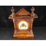 A mahogany cased mantel clock striking on the hour and half hour, Roman numerals, 36 cm (h),