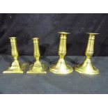 Two pairs of 19th century brass candlesticks,