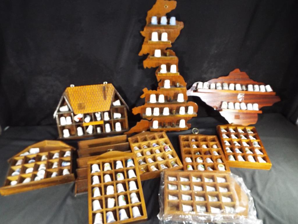 Thimbles - nine wooden displays various sizes and themes,