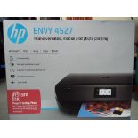An HP Envy 4527 printer and scanner still sealed in original box Est £20 - £40