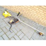 A Partner B325 petrol strimmer with harness.