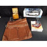 A mixed lot to include unused brown leather bag, unused boxed bartender's set,