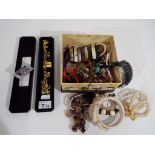 A jewellery box containing a quantity of good quality predominantly modern costume jewellery to