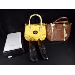 A lot to include a handbag marked Mulberry, a further bag marked Michael Kors and a pair of size 8.