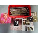 A quantity of 33 and 45 rpm vinyl records and a small quantity of CDs including David Bowie,