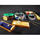 A good mixed lot of costume jewellery, enamelled bracelets, a yellow metal tie pin,