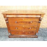 A good quality chest of three drawers with additional secret drawer, bun handles,