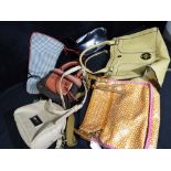 A collection of six handbags with variou