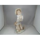 A Zaphir figurine of a girl with a lamb.