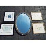 An oval framed bevel edged wall mirror a
