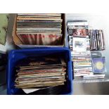 Two boxes of 33.3 rpm vinyl records and