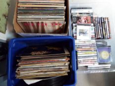Two boxes of 33.3 rpm vinyl records and