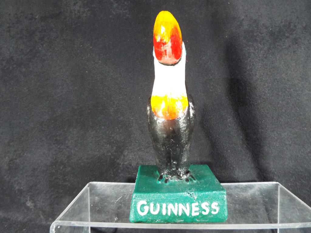 A cast figure depicting a toucan and marked 'Guinness' to the green base, 19. - Image 2 of 2