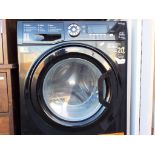 Hotpoint - a Hotpoint 9 kg washer/dryer with digital display, model number LVA2008TRF [black].