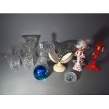 A mixed lot of glassware to include vases, drinking glasses, paperweights and similar,