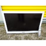 A Panasonic Viera 28inch LCD TV with remote and a clear glass display table (2)