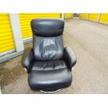 A reclining swivel leather office chair