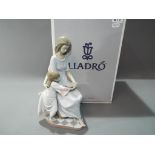 Lladro - a large Lladro figurine, entitled Bedtime Story #05457 with certificate in original box,