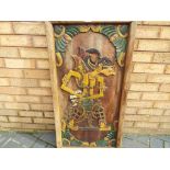 A large carved wood picture depicting a Wayang (Indonesian puppet). Approximately 98 cm x 51.