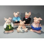 Wade - a collection of five Nat West pigs.