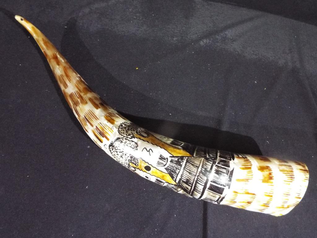 A large hand painted cow horn, approximately 57 cm [L].