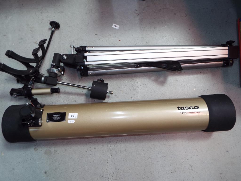 A Tasco Luminova telescope with tripod stand [2].