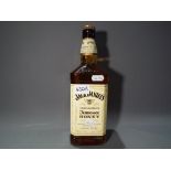A 1 litre bottle of Jack Daniels Tennessee Honey Whisky Liqueur, 35% ABV.
