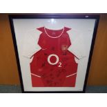 A framed Arsenal shirt from the 2003/2004 Invincibles season bearing signatures and with a