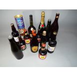 Breweriana - a collection of fourteen spirits and beer bottles,