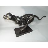 A decorative model depicting a jaguar,