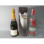 A 750 ml bottle of Laurent-Perrier champagne 12 % ABV contained in presentation box and a 1 litre