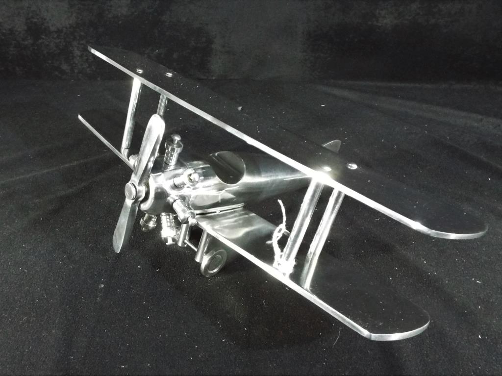 A white metal model of a Bi-Plane,