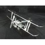 A white metal model of a Bi-Plane,