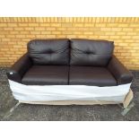 A good quality two seat sofa still in factory wrapping.
