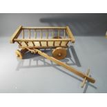 A child's wooden cart.